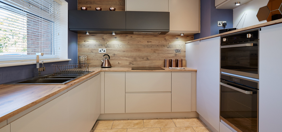 Wilsonart Laminate Worktop with matching splashback in Mississippi Pine, installed in a residential kitchen. 